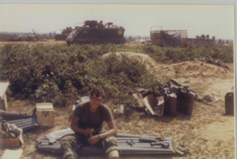 Lt cleaning my M-16 along the DMZ
